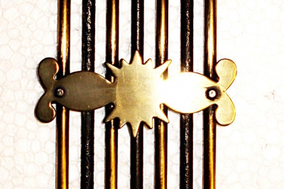 Bovenstuk van een comtoise  harp- of banjoslinger